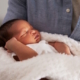 Image shows a sleeping baby